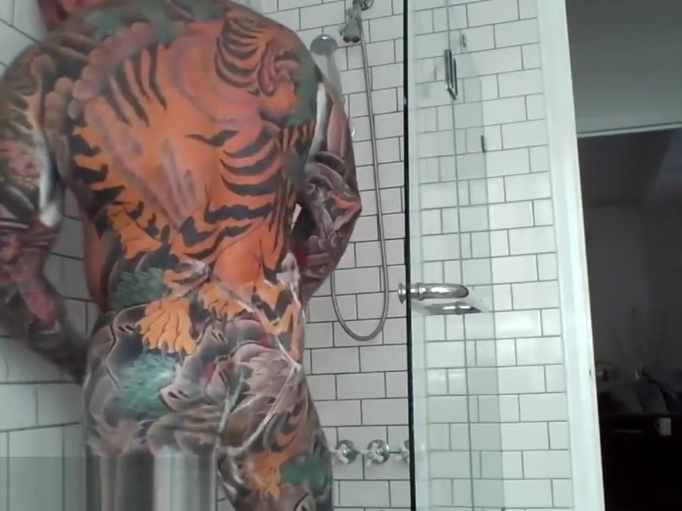 Tattooed muscle stud showers