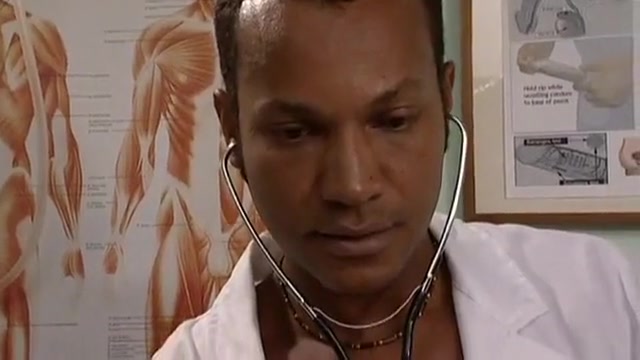 Black doctor examines white gay