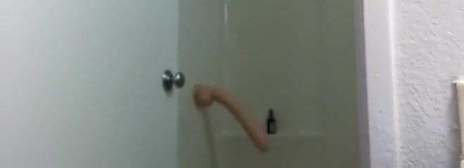 Guy fucks huge dildo in the shower