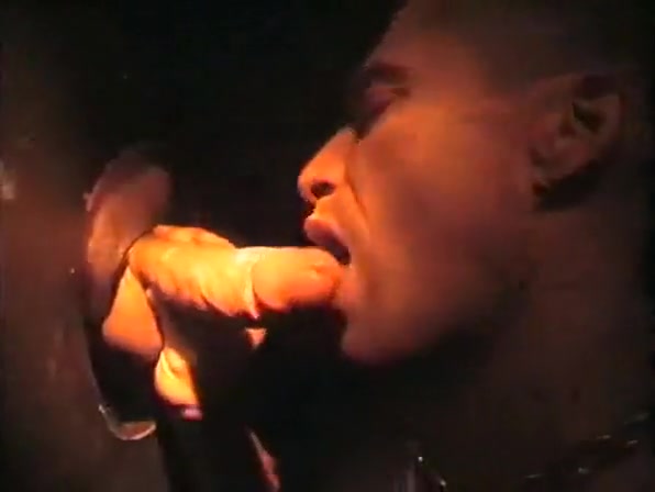 Sucking cock at a gloryhole