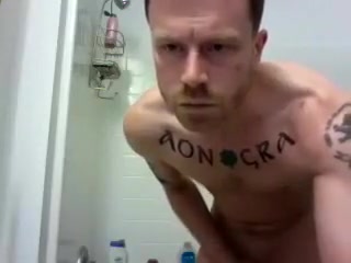 hunky tat man in shower