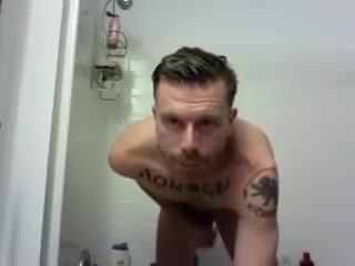 hunky tat man in shower