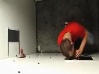 Enjoying a horny cock through the gloryhole