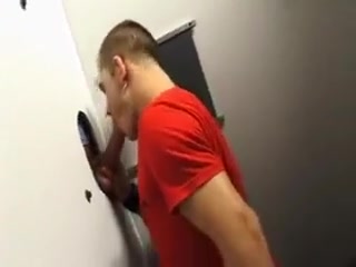 Enjoying a horny cock through the gloryhole