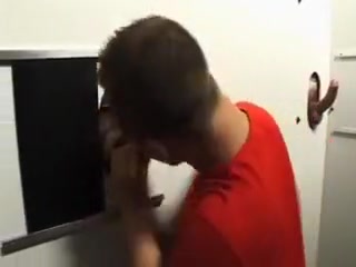 Enjoying a horny cock through the gloryhole