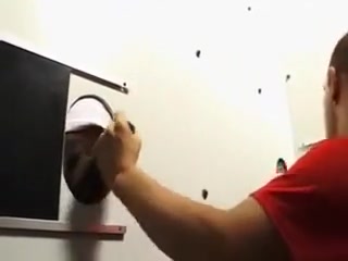 Enjoying a horny cock through the gloryhole