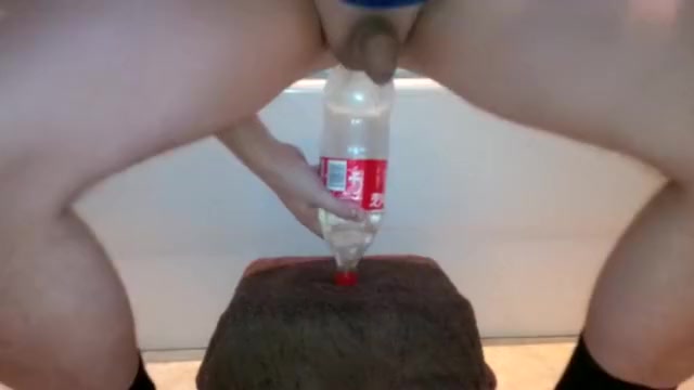 Anal stretching with a bottle, massive plugs and fisting