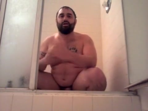Bearcubwoof in the shower with his fresh toy