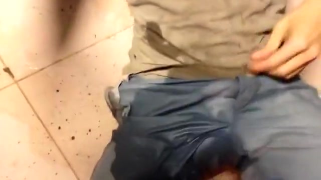 Squat pissing at public hotel pool shower room