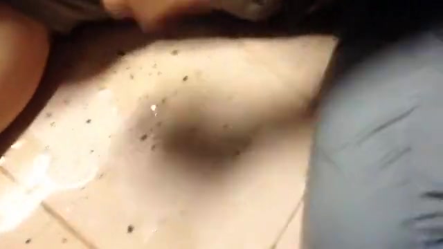 Squat pissing at public hotel pool shower room