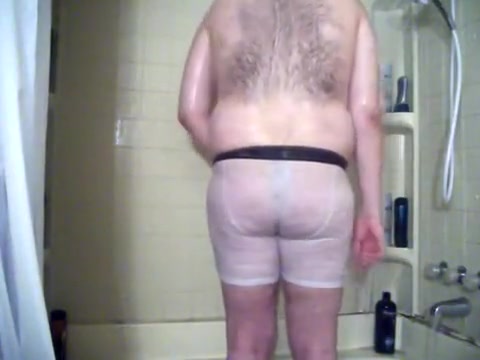 Showering in white boxer briefs