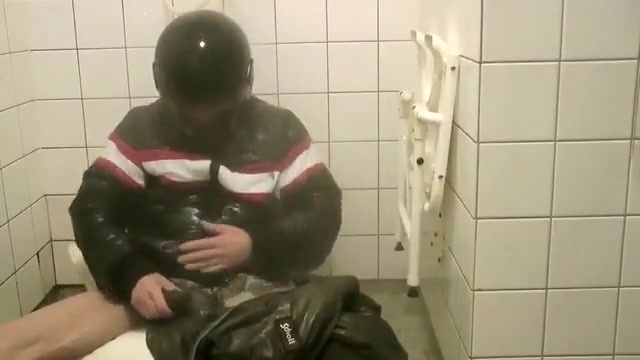 SHOWERING IN BOMBER HELMET AND PVC JACKET