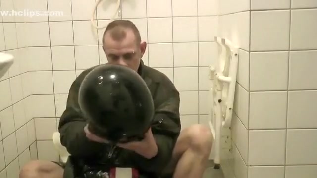 SHOWERING IN BOMBER HELMET AND PVC JACKET