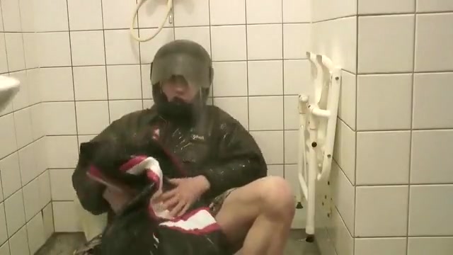 SHOWERING IN BOMBER HELMET AND PVC JACKET