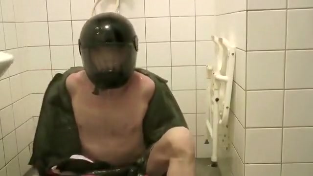 SHOWERING IN BOMBER HELMET AND PVC JACKET