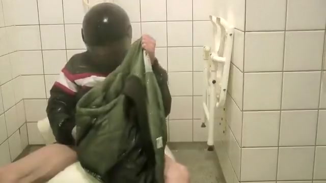 SHOWERING IN BOMBER HELMET AND PVC JACKET