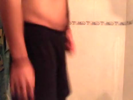 latin muscle taking a shower