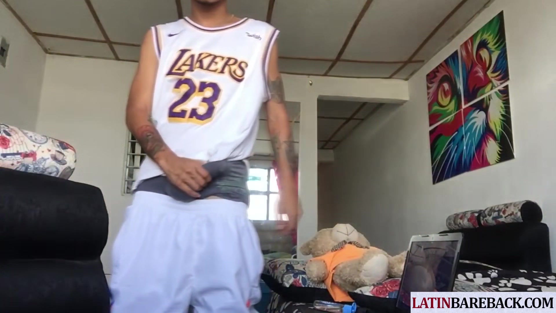 Tattooed twink latino tugging his shaved cock