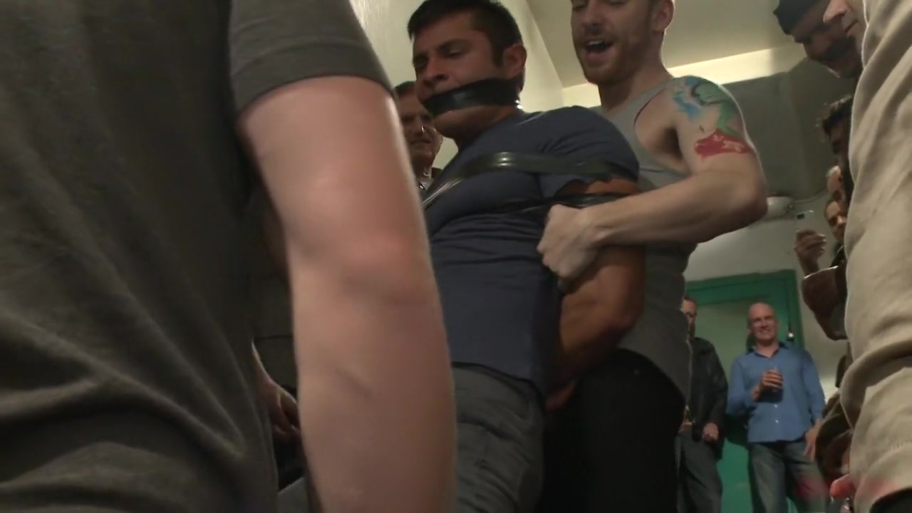 Muscled hunk tormented & gang banged in a stairwell full of horny men
