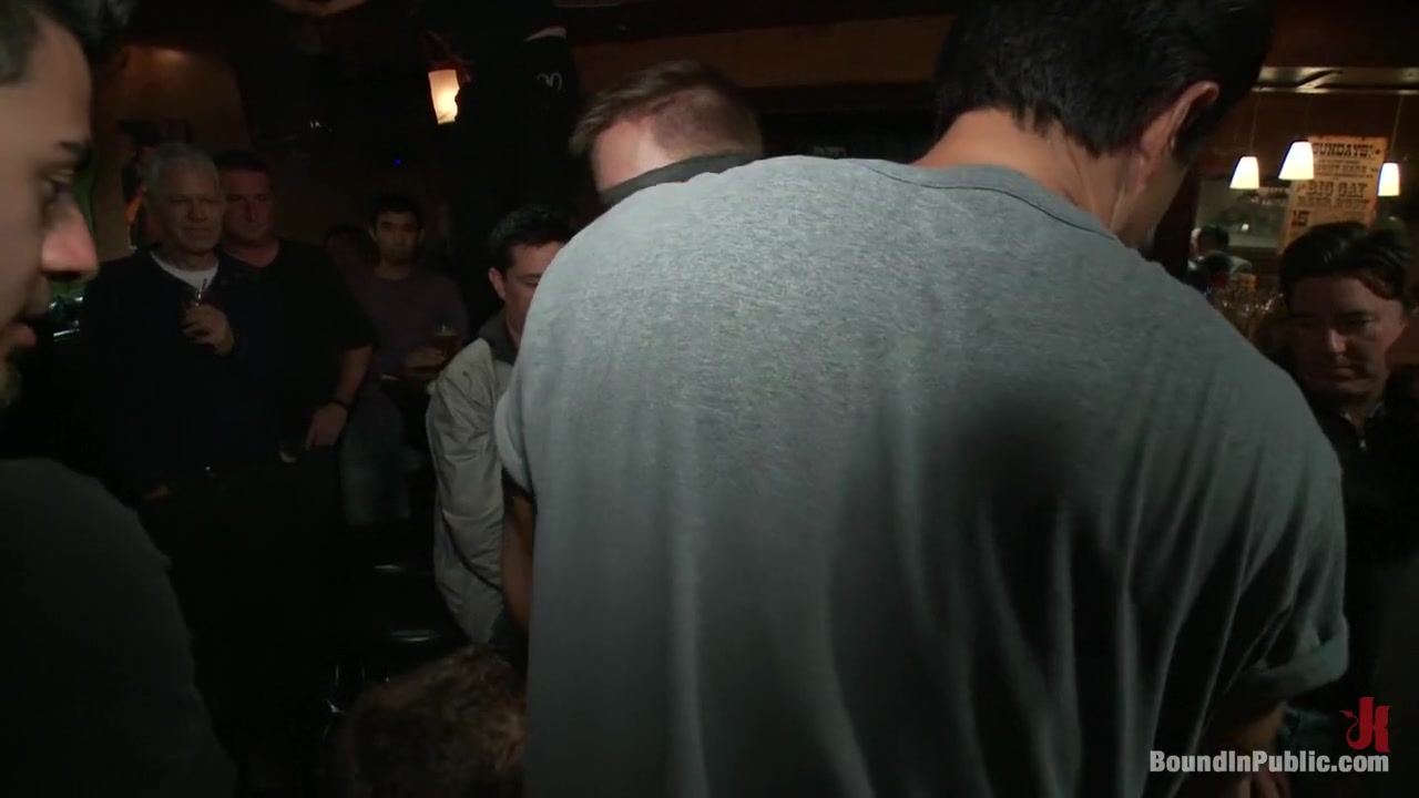 Naked ripped stud gets humiliated and used in a crowded public bar.