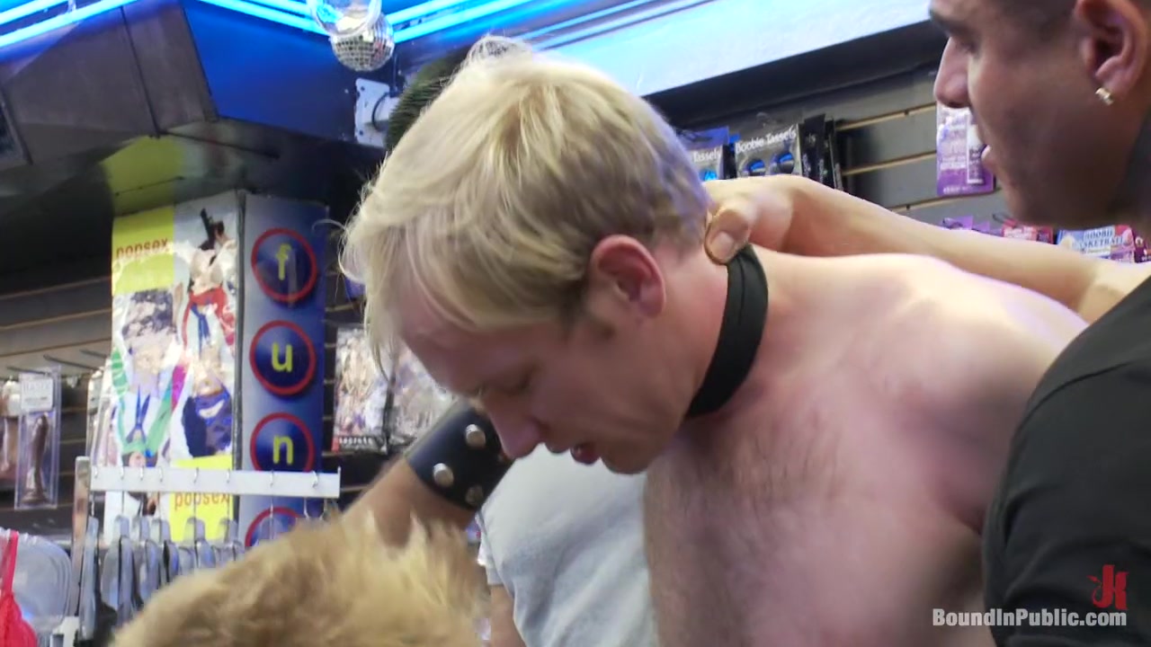 Two thugs drag a businessman into a porn shop and strip him of his manhood.
