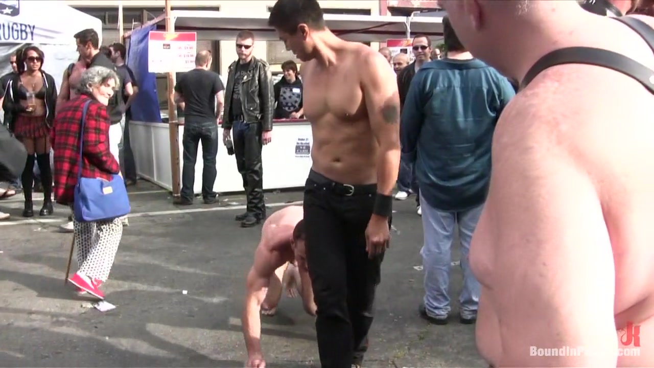 Muscle slave is stripped naked, used and humiliated while hordes of people take photos.