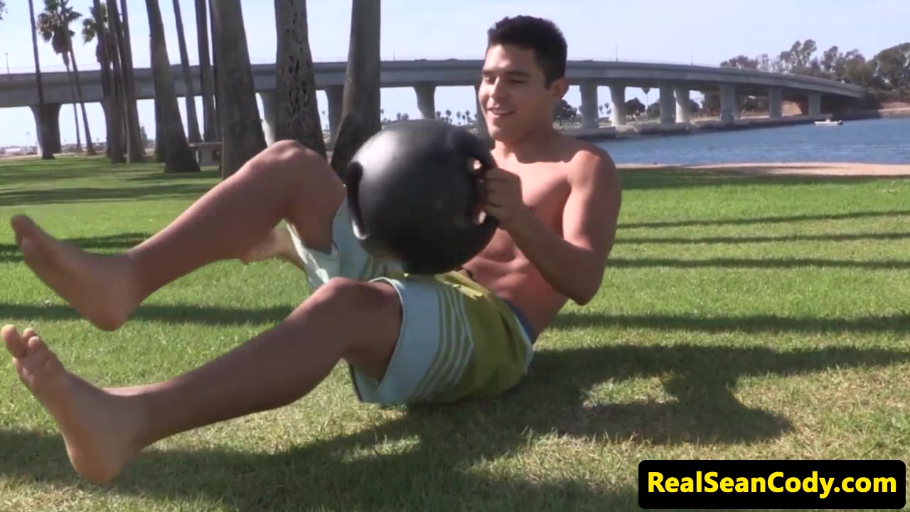 Sporty hunk jerking off after working out