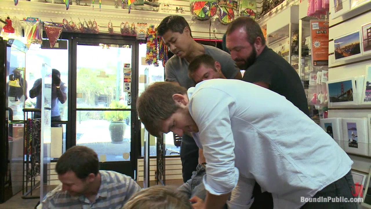 Bound in Public. A mob of men punish a thief with a giant cock