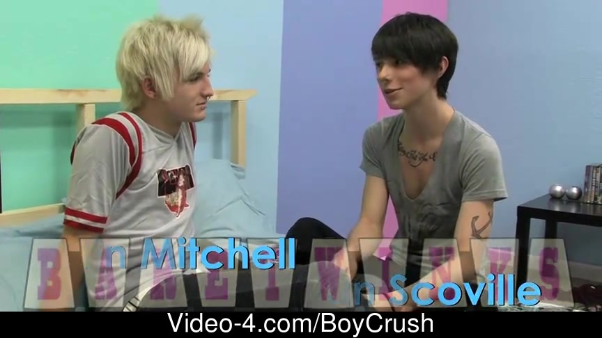 The camera is pointed at Austin Mitchell and Dylan Scoville as they sit in couch and longing after every other