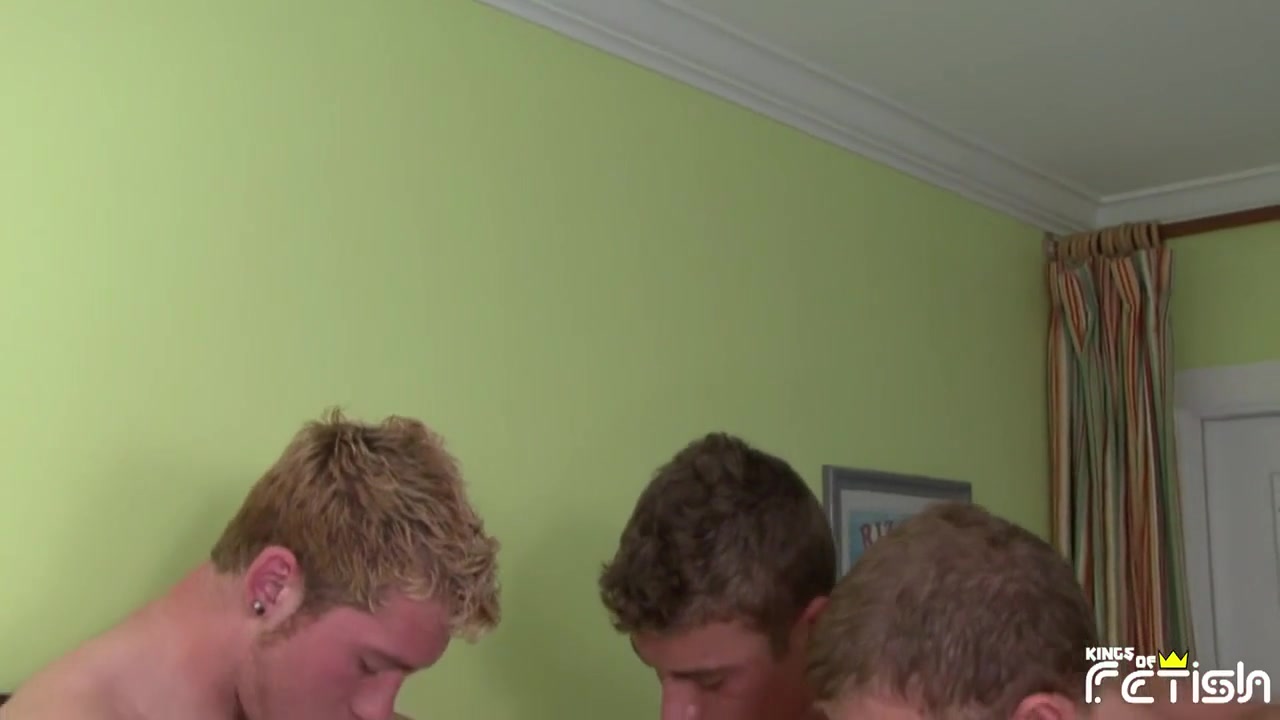Brunette guy blows deep three dudes big cocks on the bed and swallows cum