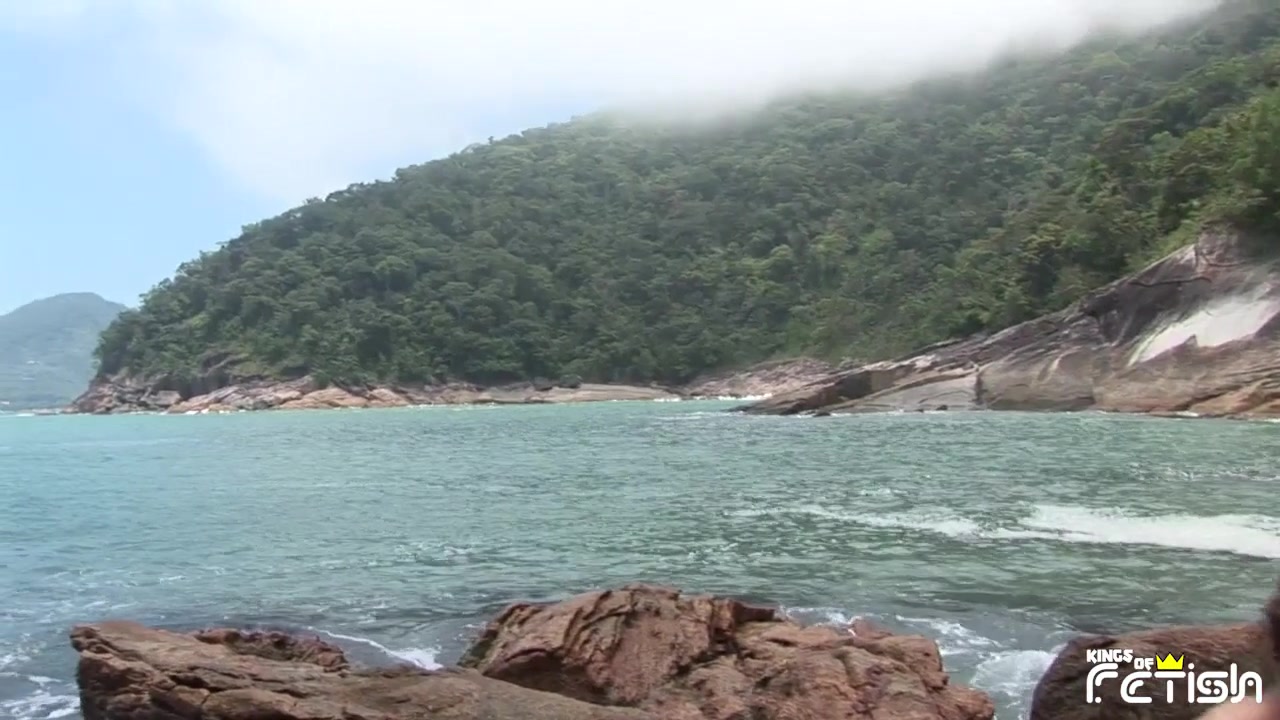 Tattooed guy and his partner pound their asses on the rocks by the sea