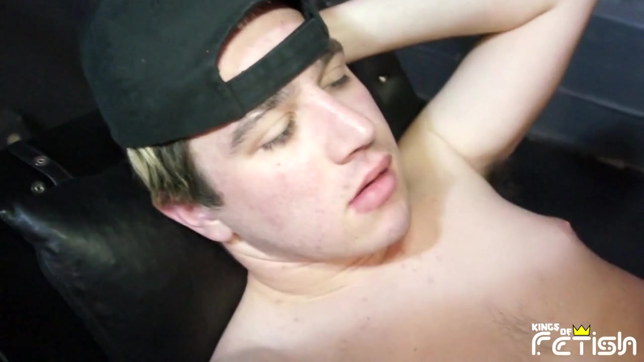 Tattooed man fucks a twink guy with tight ass after getting his big cock sucked trough gloryhole