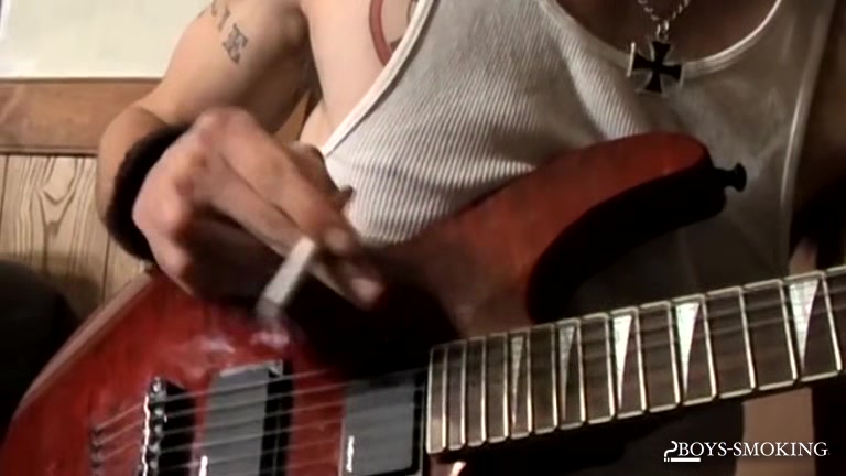 BoysSmoking: Axel Smokes Heavy While Rocking Out And Stroking His Dick