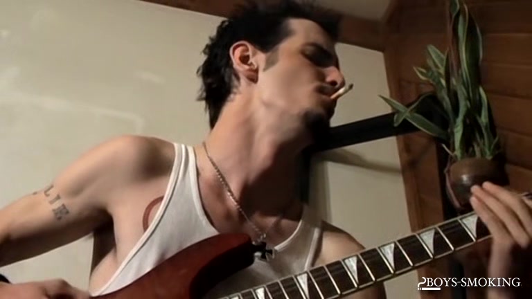 BoysSmoking: Axel Smokes Heavy While Rocking Out And Stroking His Dick