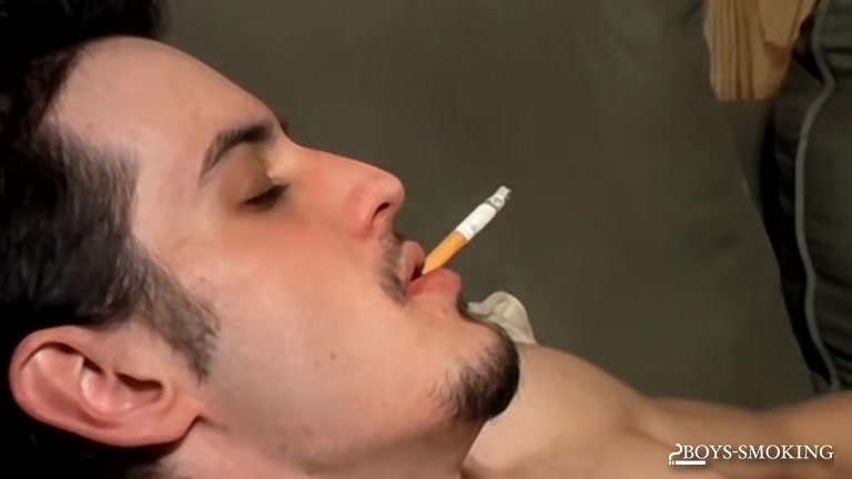 BoysSmoking: Axel Smokes Heavy While Rocking Out And Stroking His Dick
