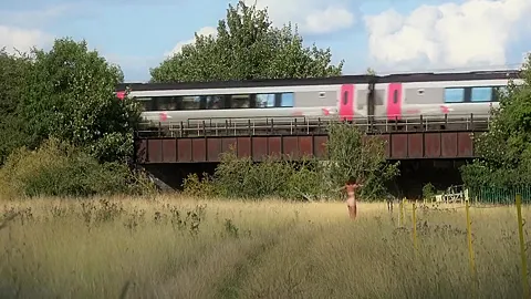 In An English Meadow And Flashing On The Train