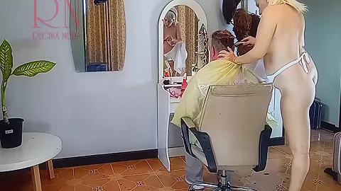 Nudist Barbershop. Nude Lady Hairdresser In An Apron. The Client Is Surprised. 3