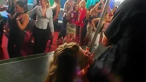 Excited party chicks suck cocks in club orgy