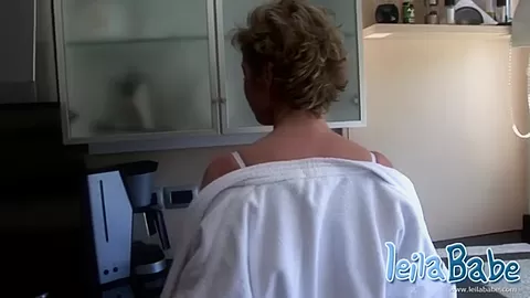 MILF gets naked after morning coffee