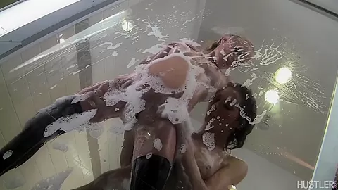 Lesbian lovers have steamy shower sex