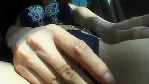 Busty MILF masturbates in solo car scene