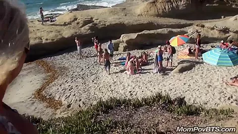 Busty MILF beach flashing tits