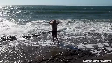 Busty MILF beach flashing tits