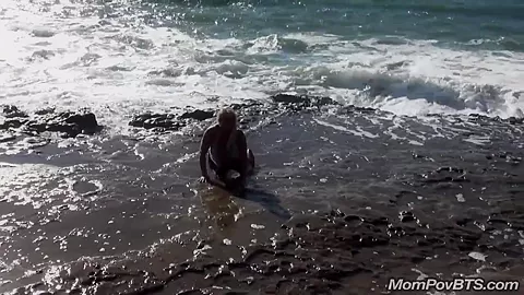 Busty MILF beach flashing tits
