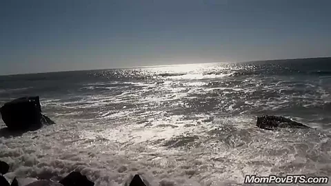 Busty MILF beach flashing tits