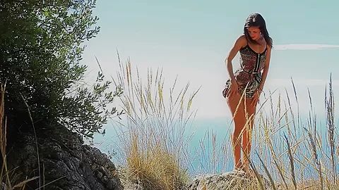 Art porn video of Carol masturbating on a beach