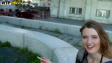 Slutty blonde having a dirty talk in the street