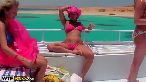 Three total hotties pose on a luxurious yact