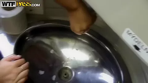 Krystinka uncovers her pussy and pisses