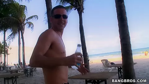 Two horny guys walking along Brazilian beach